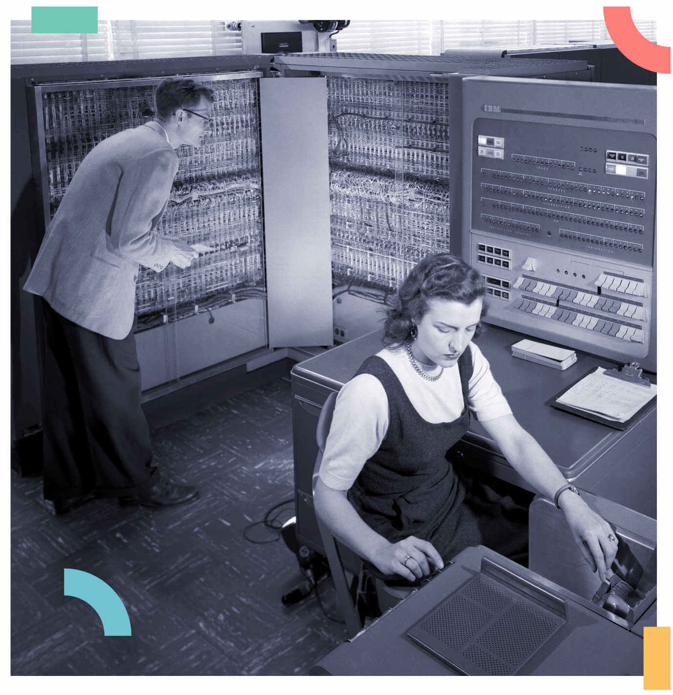 2 professionals monitoring a vintage computer